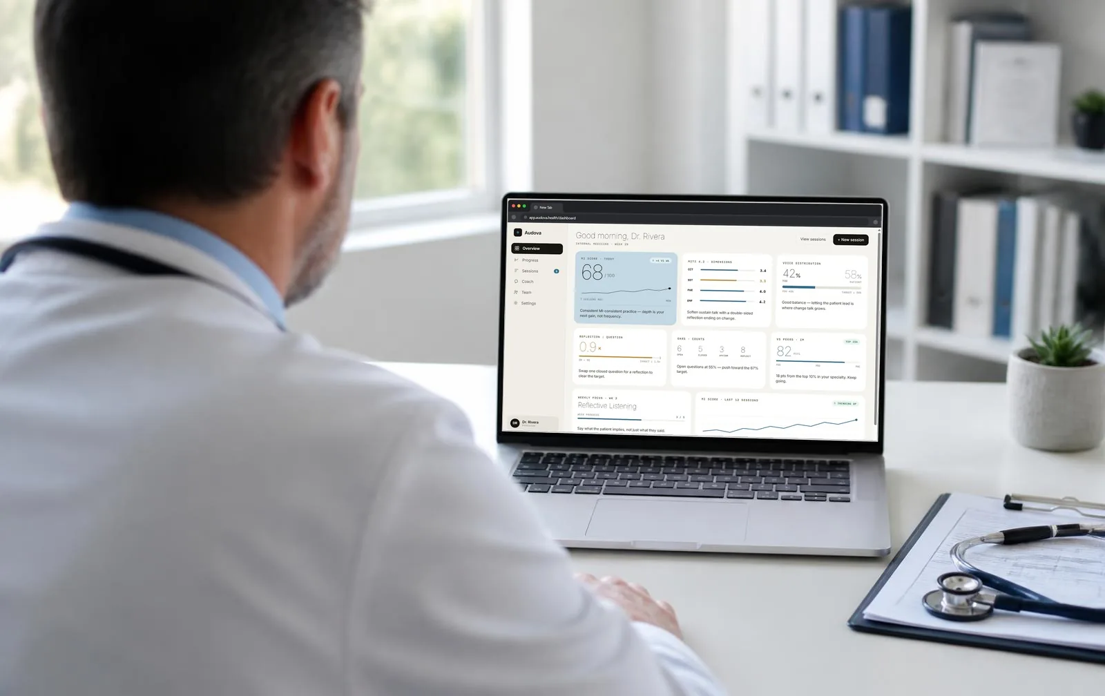 Physician reviewing the Audova™ dashboard on a laptop